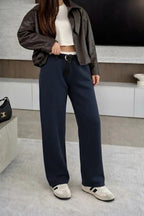 Oversized pants with belt and white stripe